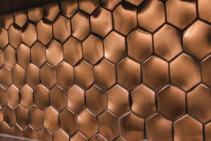 L'antic Colonial bronzen hexagon mozaïek